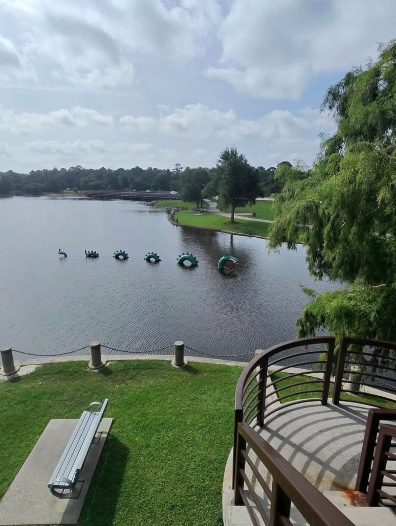 The Lake Woodlands dragon sculpture watching over the water where the Paddle Crew paddles
